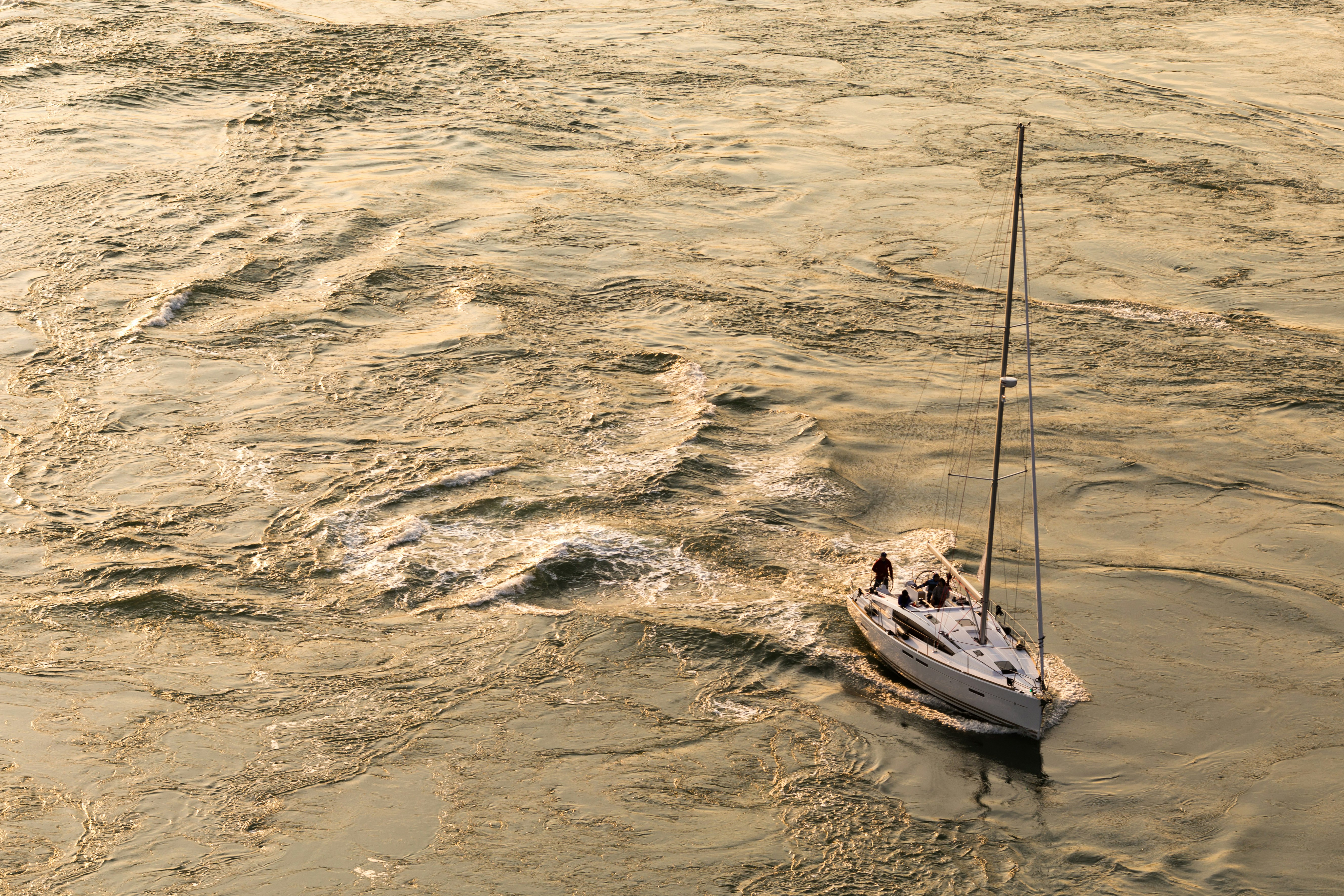 white motorboat on body of water